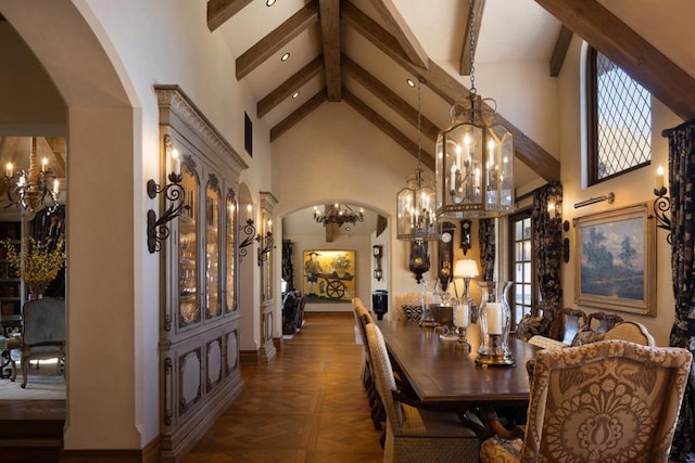 dining room with beam ceiling, dark parquet floors, high vaulted ceiling, and plenty of natural light