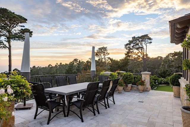 view of patio terrace at dusk