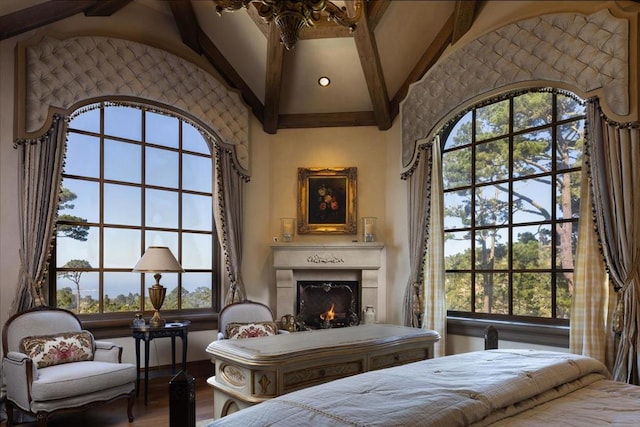 bedroom featuring vaulted ceiling with beams and hardwood / wood-style floors