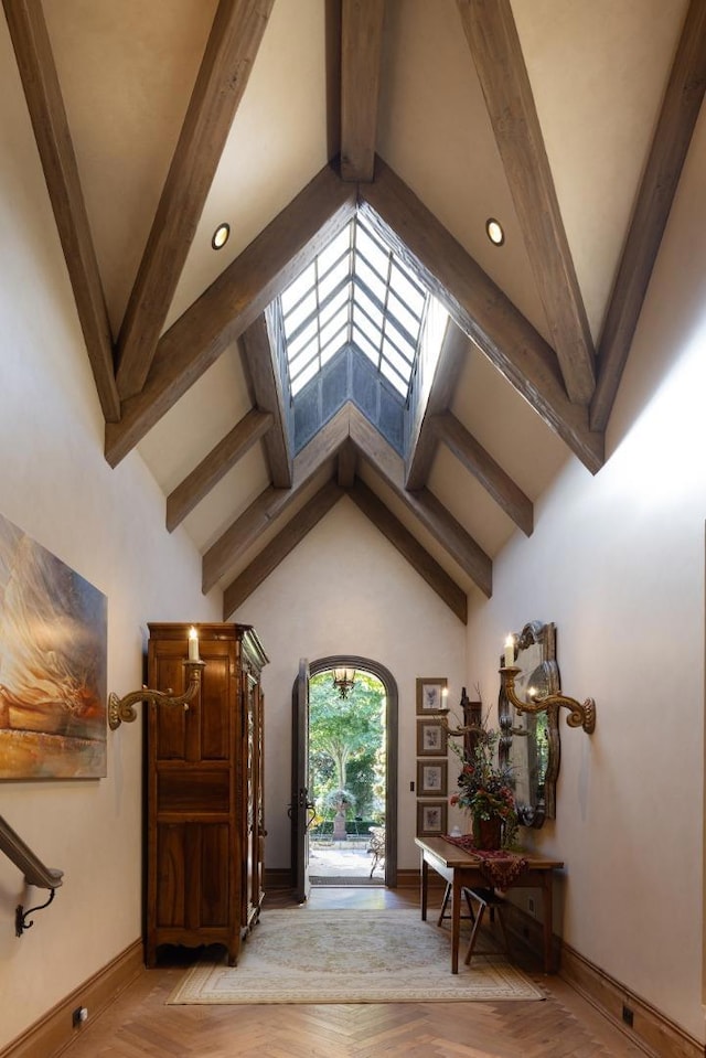 foyer featuring lofted ceiling with beams