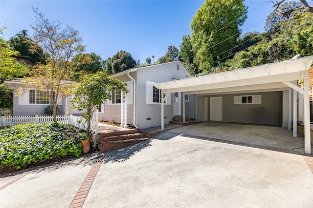 ranch-style house with a carport