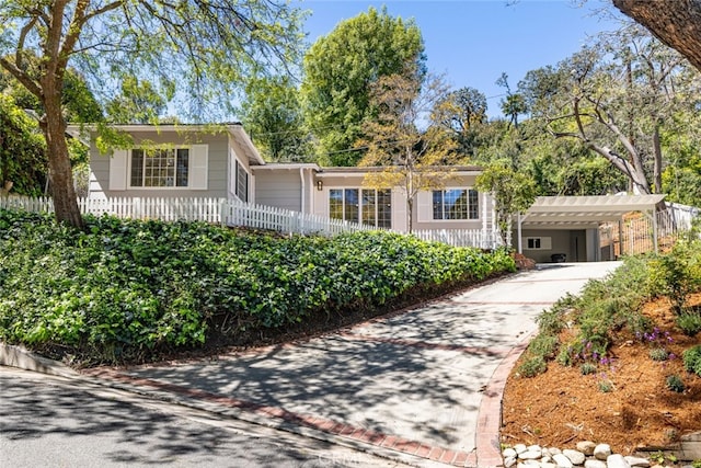 ranch-style house with a carport