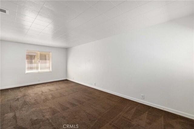 empty room featuring carpet floors