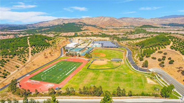 birds eye view of property with a mountain view