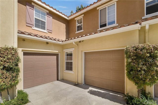 mediterranean / spanish house featuring a garage