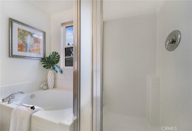 bathroom featuring plus walk in shower