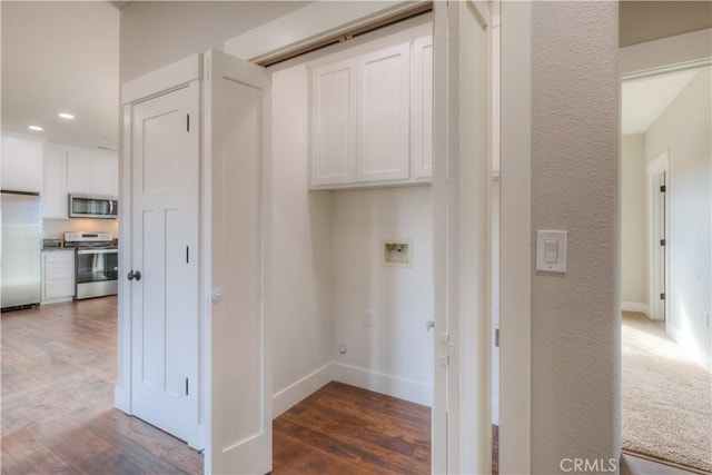 laundry room with washer hookup and dark hardwood / wood-style floors