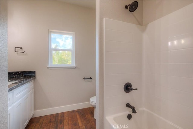 full bathroom with shower / tub combination, toilet, vanity, and wood-type flooring