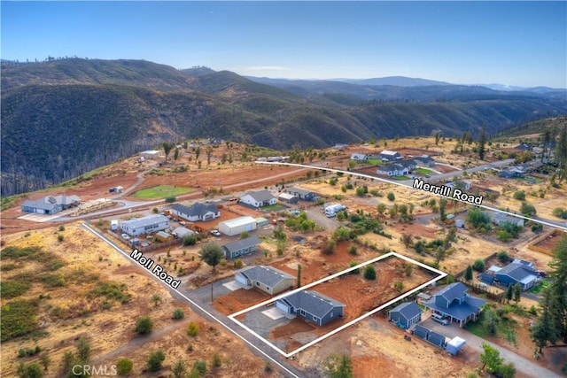 birds eye view of property featuring a mountain view