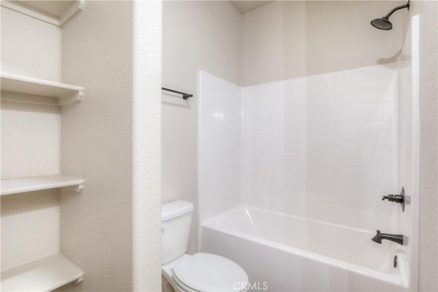 bathroom featuring toilet and shower / bathing tub combination