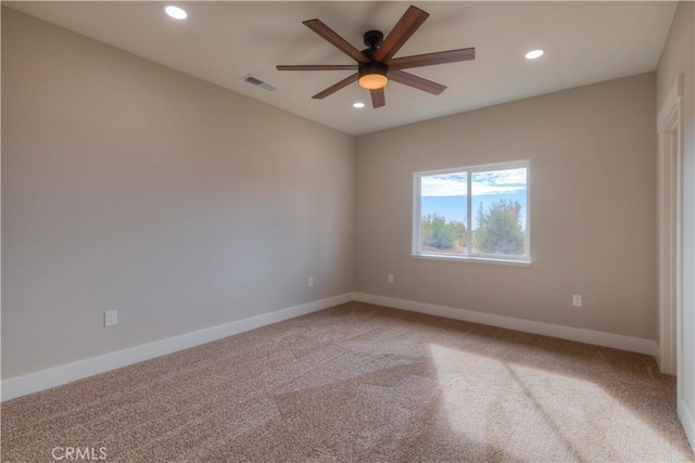 unfurnished room featuring ceiling fan and carpet floors