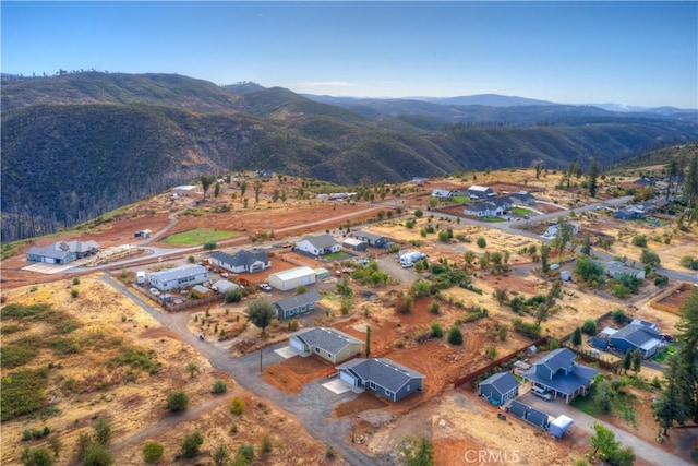 birds eye view of property with a mountain view