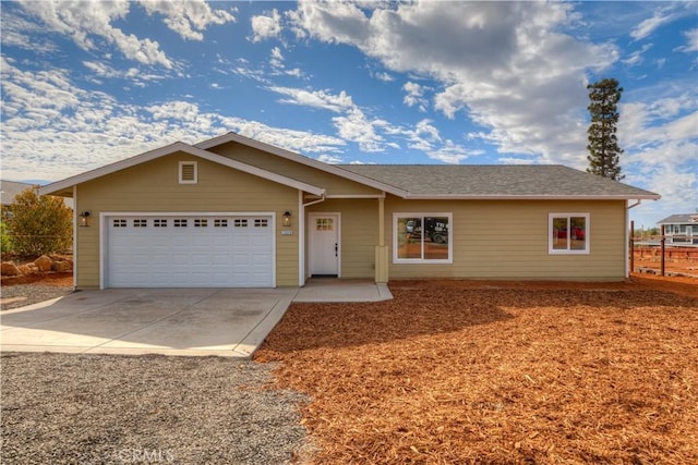 ranch-style home featuring a garage