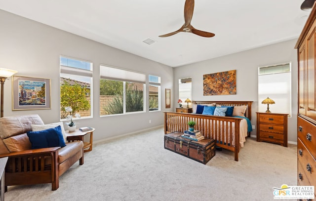 bedroom featuring light carpet and ceiling fan