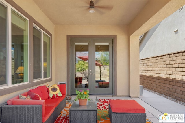 property entrance featuring outdoor lounge area, french doors, a patio area, and ceiling fan