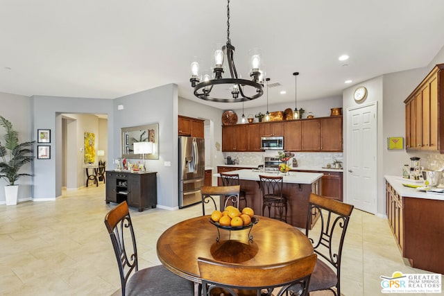 tiled dining area with a notable chandelier