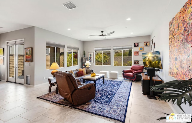 tiled living room with ceiling fan