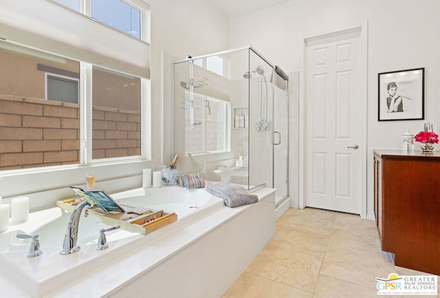 bathroom featuring plus walk in shower and tile patterned floors