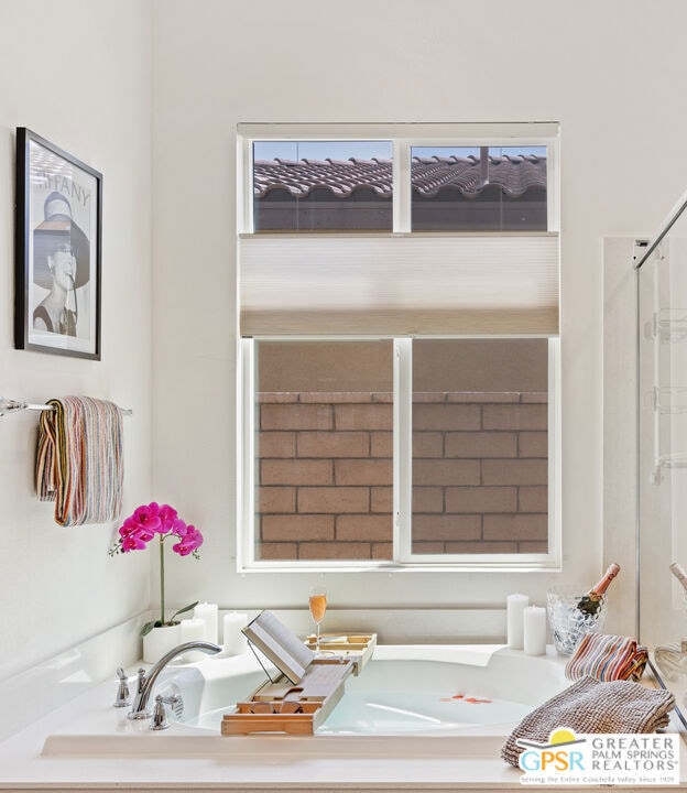 bathroom featuring a tub to relax in