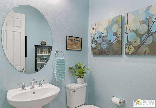 bathroom with sink and toilet