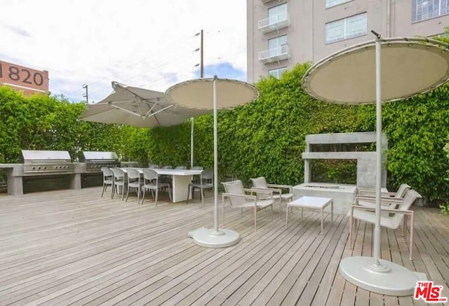 wooden terrace featuring grilling area