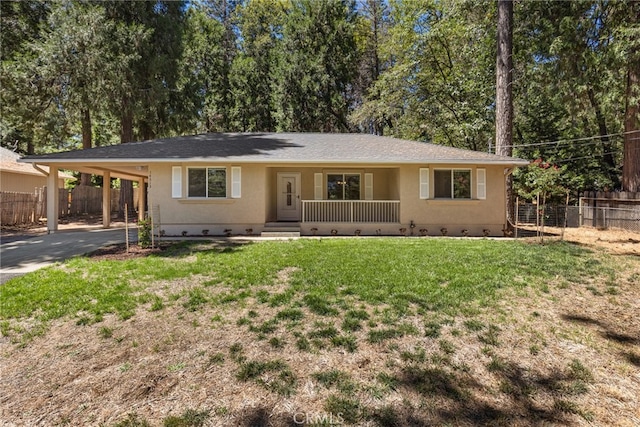 ranch-style home featuring driveway, an attached carport, crawl space, and fence