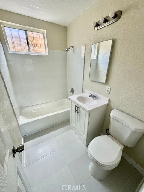 full bathroom featuring tiled shower / bath combo, tile patterned flooring, vanity, and toilet