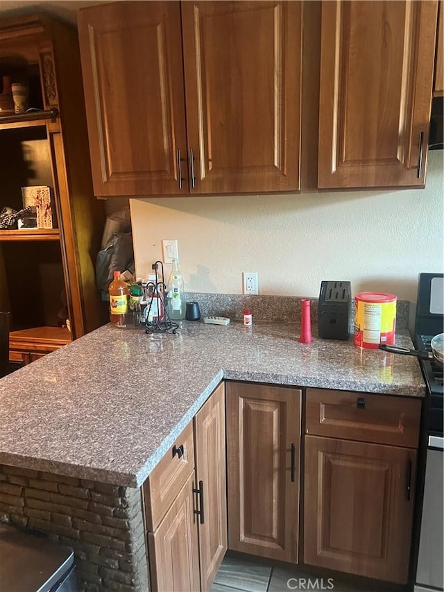 kitchen featuring light stone countertops