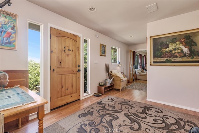 foyer entrance with light wood-type flooring