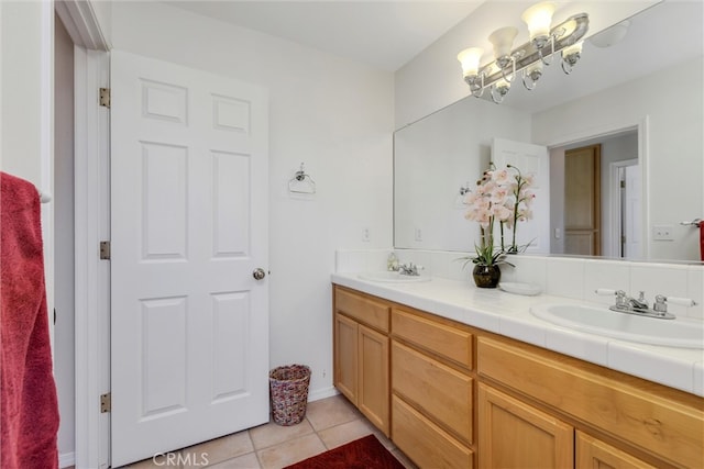 bathroom featuring tile patterned flooring and vanity