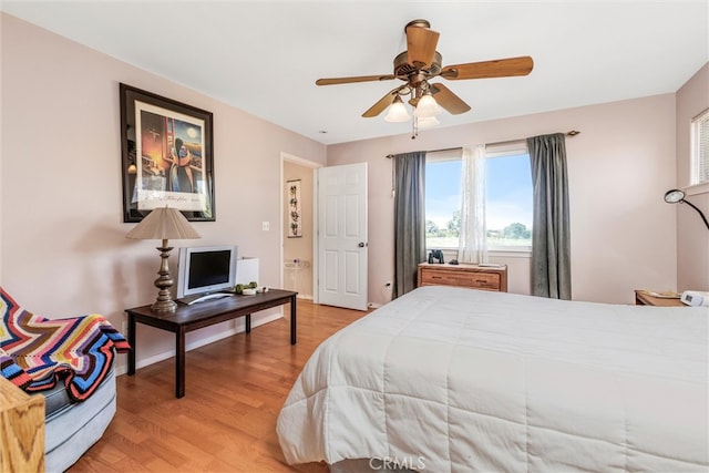 bedroom featuring ceiling fan and hardwood / wood-style flooring