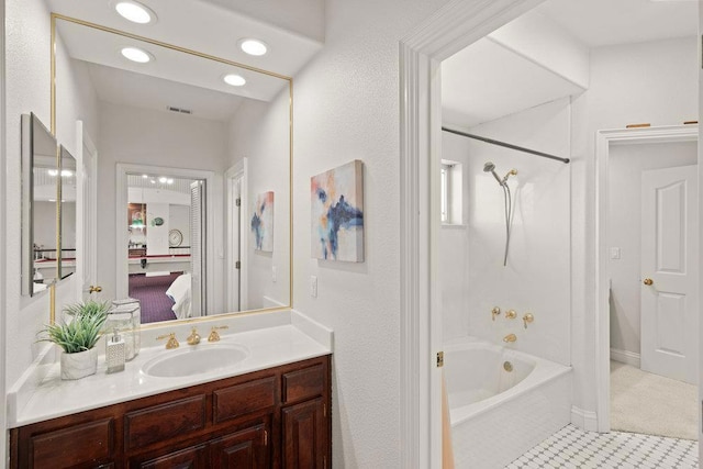 bathroom with vanity, tile patterned floors, and tiled shower / bath combo