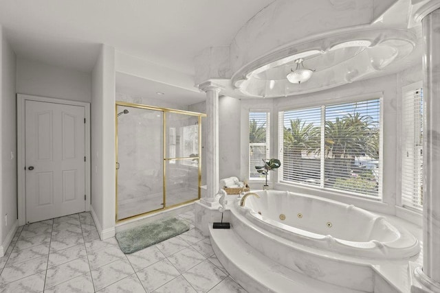 bathroom featuring separate shower and tub and decorative columns