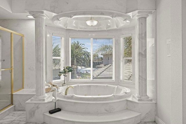 bathroom with shower with separate bathtub and ornate columns