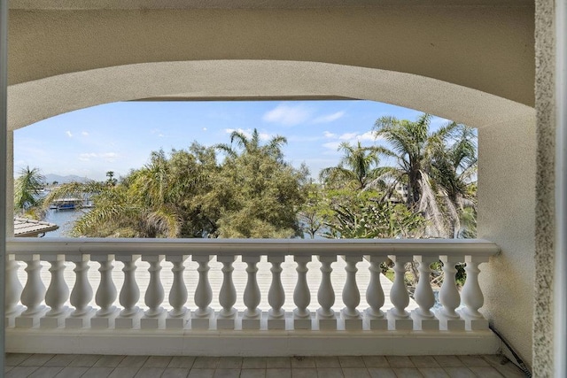 balcony featuring a water view