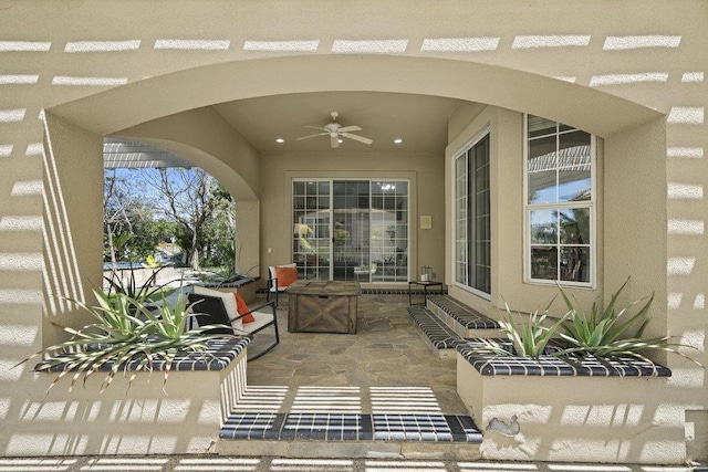 view of patio / terrace featuring ceiling fan