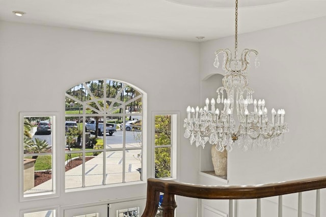 foyer entrance featuring an inviting chandelier