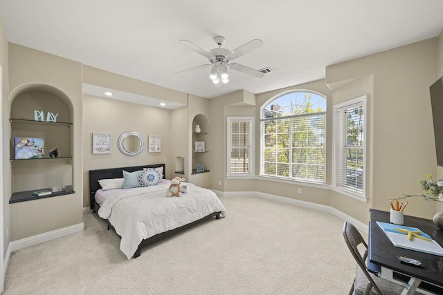 bedroom with light carpet and ceiling fan