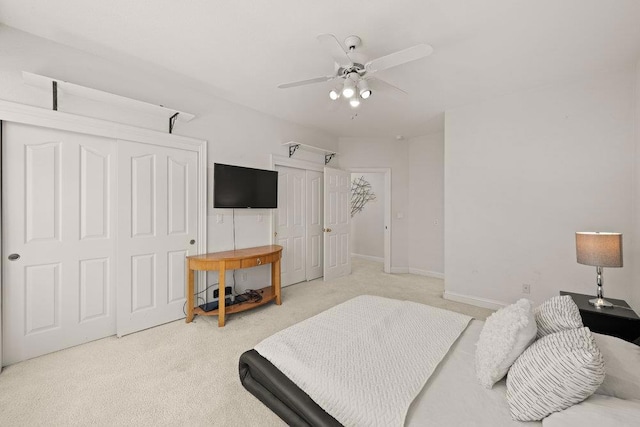 carpeted bedroom featuring ceiling fan