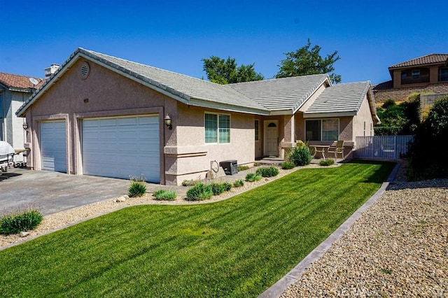 ranch-style house featuring a front lawn and a garage