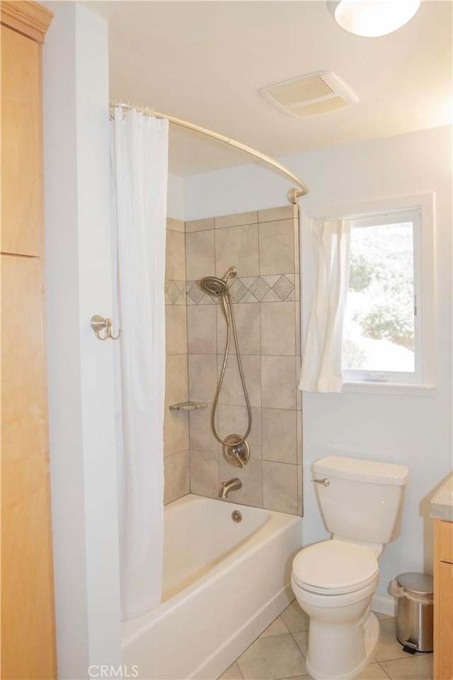 full bathroom with shower / tub combo, vanity, toilet, and tile patterned flooring