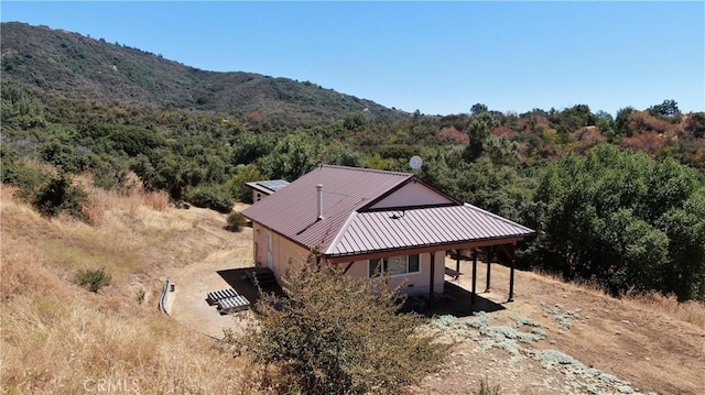 birds eye view of property featuring a mountain view