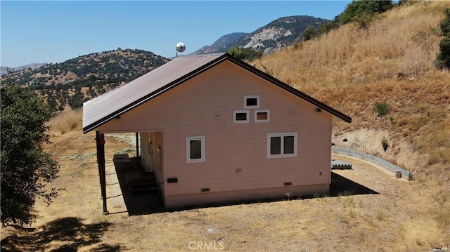 view of side of home featuring a mountain view