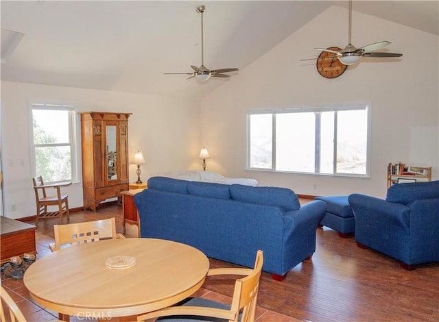 living room with high vaulted ceiling, dark wood-type flooring, and ceiling fan