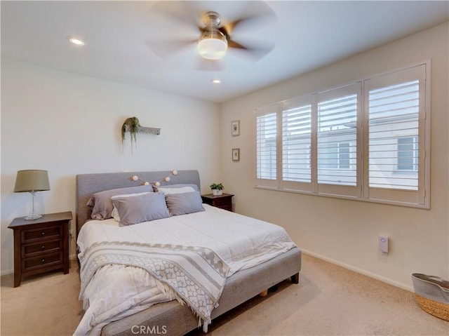 bedroom featuring ceiling fan and light colored carpet