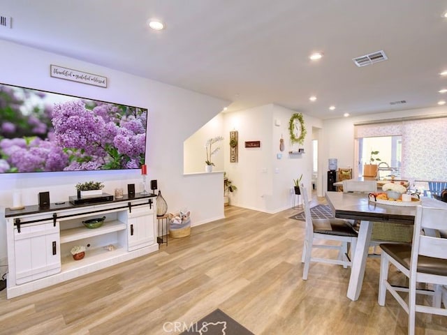 dining room featuring light wood-type flooring