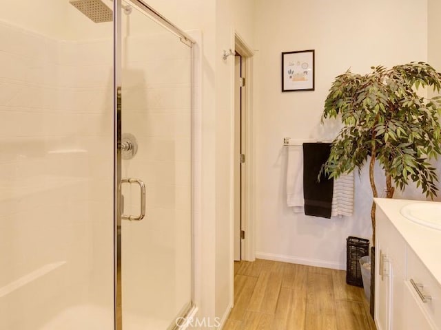 bathroom with vanity and an enclosed shower