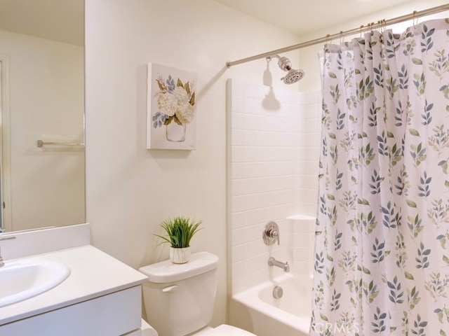 full bathroom with vanity, toilet, and shower / tub combo with curtain