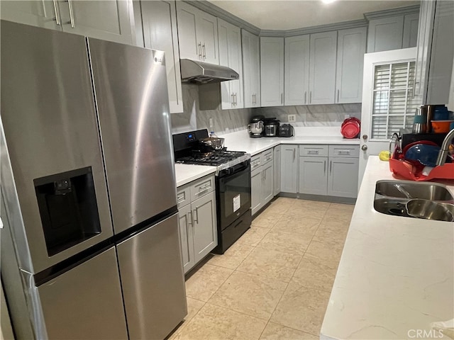 kitchen featuring gray cabinetry, tasteful backsplash, black gas range, sink, and stainless steel fridge with ice dispenser