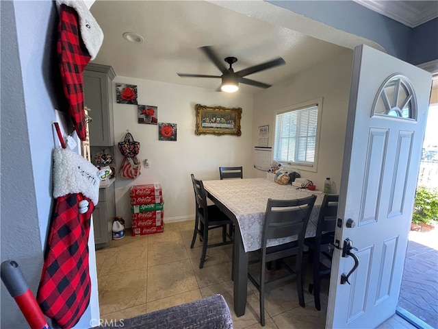 dining room featuring light tile patterned floors and ceiling fan